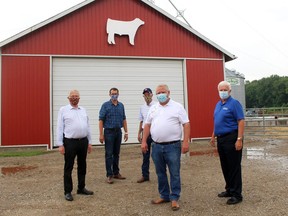 Neal Craven, middle, hosted Ontario Premier Doug Ford, front, Minister of Agriculture, Food and Rural Affairs Ernie Hardeman, left, Minister of Labour, Training and Skills Development Monte McNaughton, second left, and Chatham-Kent-Leamington MPP Rick Nicholls at his Eberts-area farm on Thursday as part of the premier's tour of the region. (Ellwood Shreve/Chatham Daily News)