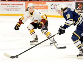 Eric Moreau, shown here preparing to engage Kirkland Lake Gold Miners forward Robert McLaughlin during an NOJHL game at the McIntyre Arena in January, will be the elder statesman of the blue-line when her returns for third season in a Timmins Rock uniform in 2020-21. The 2001-birth-year right-hand shooting Penetanguishene native, best known as being a shutdown defender, more than doubled his points total last season. THOMAS PERRY/THE DAILY PRESS/POSTMEDIA NETWORK