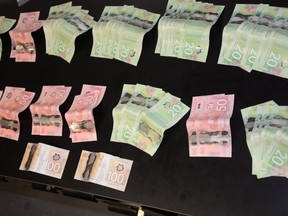 Cash seized by Sault Ste. Marie Police Service after searching a residence on Wallace Terrace. (SUPPLIED PHOTO)