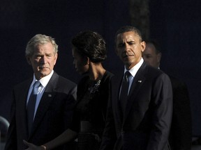 U.S. President Barack Obama, from right, first lady Michelle Obama and former president George W. Bush walk past the North Pool of the 9/11 Memorial during the 10th anniversary ceremonies of the Sept. 11, 2001, terrorist attacks at the World Trade Center site, on Sept. 11, 2011, in New York City. (Justin Lane-Pool/Getty Images)
