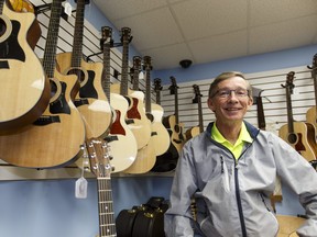 Mike Allen, owner of Campbell's Music in downtown Fort McMurray, Alta., poses for a photo in the store on Thursday June 9, 2016. Ian Kucerak/Postmedia Network