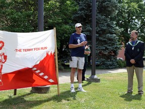 John Versaevel, the chair of the Woodstock Terry Fox Run, speaks to a crowd of people after raising the Terry Fox flag at Museum Square Wednesday July 15, 2020. The day celebrates the 40th anniversary since Terry Fox and the Marathon of Hope travelled through Woodstock.

Greg Colgan/Sentinel-Review/Postmedia Network