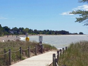 A few walkers stroll on a windy Southampton beach earlier this year.
(File photo/Frances Learment/Shoreline Beacon)