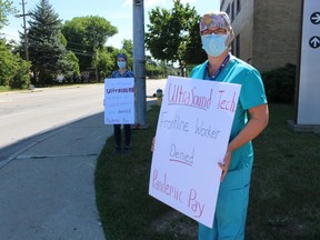 Angela McKay, an ultrasound technician at Bluewater Health in Sarnia, joined fellow OPSEU members demonstrating Monday to push the government to include them in frontline workers receiving pandemic pay.
