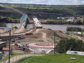 Saturday, July 18, 2020 curious observers of "new" bridge construction from Peace River High School grounds saw this scene of progress. Those inconvenienced by the 98 Street detour will, no doubt, be especially appreciative of the work to date, somewhat hampered by abundant precipitation.