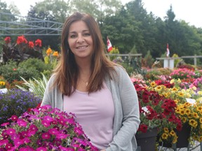 The annual Sawaya Garden Trials plant sale will be taking place on August 14 and 15, with proceeds of the sales being split between Norfolk General Hospital, Norfolk Family Resource Centre, and Jarvis Community Christian School. Lara Sawaya-Norman, marketing and coordinator at the garden, stands among some of the plants that will be available at the sale. (ASHLEY TAYLOR)