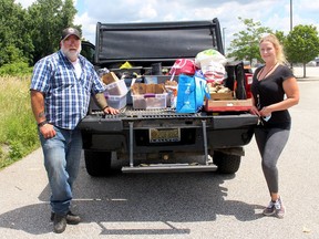 The volunteer group Reach Out Chatham Kent has been working with the Canadian Mental Health Association Lambton-Kent to help local homeless people access mental health services. ROCK volunteer Al McGuigan and CMHA psychotherapist Jessica VanKesteren were busy in July 14 delivering meals to local homeless people and reaching out to those who are in need of services offered by CMHA. Ellwood Shreve/Postmedia Network