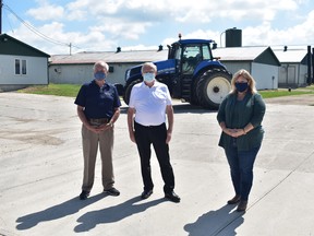 Randy Pettapiece, Parliamentary Assistant to the Minister of Agriculture, Food & Rural Affairs; Ernie Hardeman, Minister of Agriculture, Food & Rural Affairs; and Huron-Bruce MPP Lisa Thomspon visited Monoway Farms in Brussels on July 17 an announce the increase of provincial funding for the Risk Management Program. Daniel Caudle