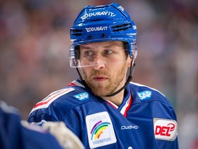 Andrew Desjardins competes for Adler Mannheim.