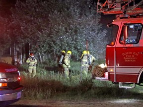 North Bay Fire & Emergency Services members attend the scene of a structure fire, Wednesday night, on Pinewood Park Drive. One person has died as a result. Michael Lee/The Nugget