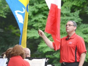 Under the direction of conductor Laurence Gauci, members of the Stratford Concert Band entertain a large crowd in Upper Queen's Park in this Beacon Herald file photo.