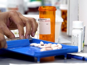 A pharmacist technician counts pills in this file photo. A shortage of medication could become an issue if there is a second wave of COVID-19, the Canadian Society of Hospital Pharmacists is warning.