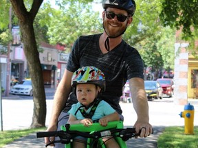 Jesse Good takes a ride in downtown Cornwall with his son in his Ibert Safe-T Seat on Friday July 17, 2020 in Cornwall, Ont. 
Jane MacMillan/Special to the Cornwall Standard-Freeholder/Postmedia Network
Jane MacMillan/Special to the Cornwall Standard-Freeholder/Postmedia Network