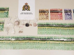 Fort RCMP said large quantities of fentanyl, with an estimated street value of $45,000, eight grams of cocaine, eight grams of methamphetamine, morphine tablets and $380 in Canadian cash were all seized during a search of a Fort residence, after they pulled over a vehicle which was having trouble maintaining the centre of its lane on July 13. Photo Supplied