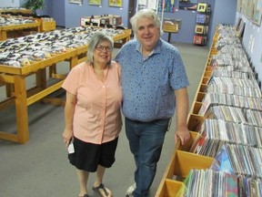 Mary Anne Peloza and Roland Peloza stand in their downtown Sarnia record shop, Cheeky Monkey.