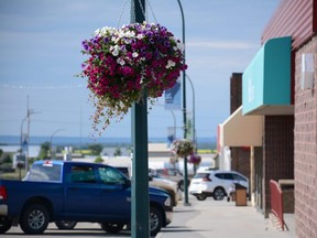 Flower baskets hanging from lamp posts help bring colour to Main Street in Fairview, Alta. on Saturday, July 11, 2020.