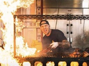 Andrew Reinhardt, director of the Western Canada Ribfest tour is pictured grilling ribs, an item available at the upcoming summer event.