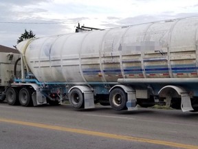 A driver and company were charged with Highway Traffic Act offences after Woodstock police report responding to an 18-wheeler truck that lost two tires. (Woodstock Police Service)