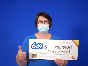Cathy Case of Watford claims the second prize in the June 27 Lotto 6/49 draw. Handout
