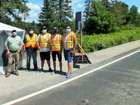 Photo by Leslie Knibbs/For The Mid-North MonitorWorking the checkpoint in Sagamok are: Chief Nelson Toulouse, Mitchel Eshkakogan, Maxwell Abitong, Clinton Manitowabi and supervisor Orion Southwind.