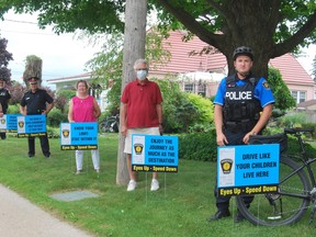 Hanover Police Service has developed traffic calming strategies which includes The Speed Awareness Signs, which have been recently deployed and distributed to community members in speed complaint zones designed to increase driver awareness. In this photo, from left to right: Deputy George Hebblethwaite, Police Board Chair Don Smith, Chief Chris Knoll, Hanover Mayor Sue Paterson, Hanover citizen Jack Lisenchuk and Constable Derek King. KEITH DEMPSEY