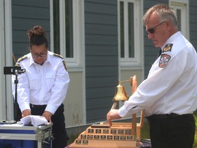 Ron Laverty, a paramedic from Sioux Lookout, rings the paramedic memorial bell as Andrea Joyce, director of paramedic services in Whitefish Bay First Nation, read the names of 50 paramedics who have died in the line of duty or lost a battle with PTSD over the years in a ceremony that took place on Thursday July 16.