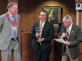 Brantford Mayor Kevin Davis (left) and Coun. John Utley (right) congratulate Jeff Moore, business manager of golf operations for Northridge Municipal Golf Course and Learning Centre and Arrowdale Municipal Golf Course, on winning the PGA of Ontario's junior golf leader of the year award in 2019.