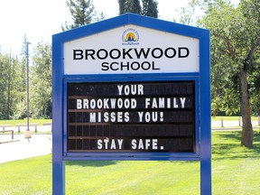 A sign outside of Brookwood School urges students to stay safe. Educational facilities across the world closed due to the COVID-19 pandemic at the start of the year and the Alberta government recently announced plans to get kids back in buildings in September.