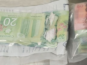 Along with a quantity of drugs, Ontario Provincial Police seized more than $6,500 in Canadian currency following a search of a residence in Sturgeon Falls, Wednesday. Ontario Provincial Police Photo