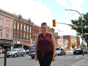 Ryzhome Networks and Festival Hydro vice president of IT Delia Campbell stands at the corner of Ontario Street and Downie Street, one of Stratford's 24 "smart intersections" at which traffic lights now have the ability to communicate with autonomous vehicles. (Galen Simmons/The Beacon Herald)