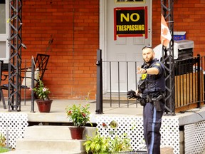 Police surrounded this house on Talbot Street South in Simcoe Thursday before arresting a person inside on suspicion of theft. Two people from Delhi have been arrested so far in the investigation, with more arrests anticipated, the Norfolk OPP report.