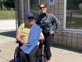 Mitchell's McKenzie Hinz, along with support worker Kara McNicoll, stand at the West Perth Lions Pool. A fundraising campaign is ongoing to purchase an accessible chair lift for Hinz at the pool. SUBMITTED