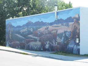The cattle drive mural on Beverly McLachlin Drive. Town of Pincher Creek council allocated funds for it's repair.