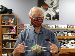 Pat McGill models a pair of face masks made by the Mukwano Women’s Group which are for sale in Sarnia-Lambton for $10 each. All money made from the masks goes back to help support the women’s families and communities in Uganda.
(Carl Hnatyshyn/Sarnia This Week)