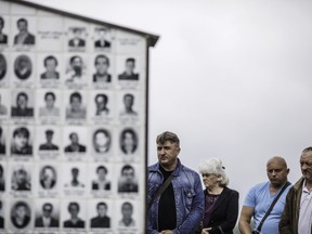 Bosnian Serbs wait for the beginning of the ceremony commemorating their victims killed 28 years ago, on July 12, 2020 in Zalazje, near Srebrenica, Bosnia and Herzegovina. As the 25th anniversary of Srebrenica genocide, in which over 8,000 Bosnian Muslim men and boys were killed by Serb forces is marked, local Bosnian Serbs are organizing events to celebrate what they say was the liberation of Srebrenica and to commemorate their victims of the Bosnian war. (Getty Images)