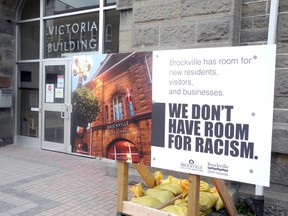 A sign in front of city hall declares that the city doesn't have room for racism. Wayne Lowrie/Recorder and Times