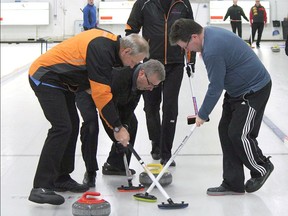 FILE — A-Draw runner-up skip Kevin Hedley looks on and directs traffic with his sweepers hard at work during the Westridge Curling Club's men's bonspiel in Stony Plain.