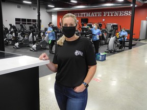 Kelly Kozak, who owns and operates Brantford's World Gym with her brother, Scott Hookey, is backed by employees of Brantford's Executive Janitorial who have been disinfecting the gym from top to bottom in preparation for a re-opening celebration on Monday morning.