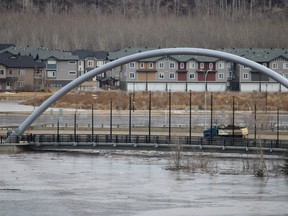 A truck crosses the Saline Creek Bridge in Fort McMurray as flood waters from the Clearwater River rise on Monday, April 27, 2020. Vincent McDermott/Fort McMurray Today/Postmedia Network
