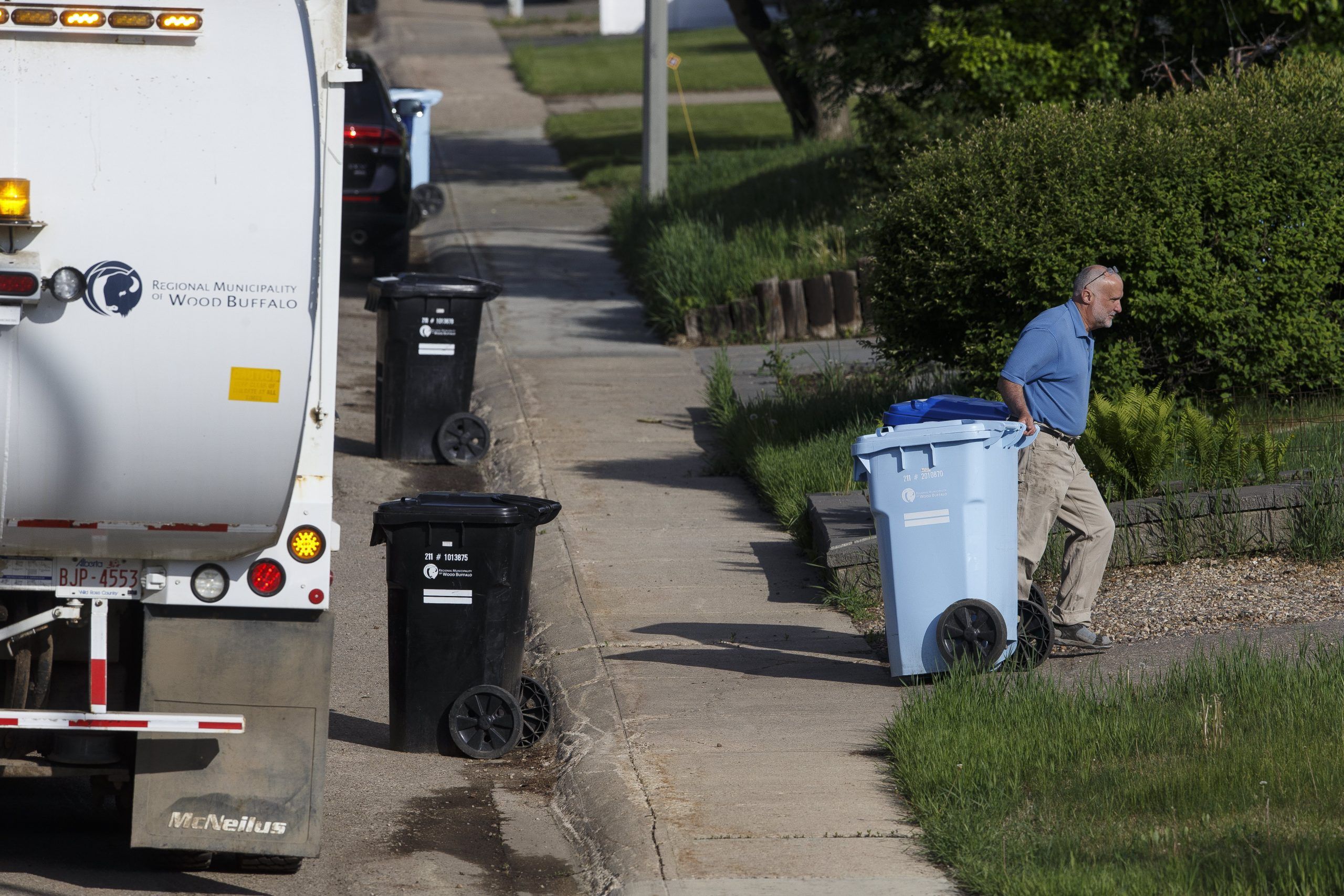 Curbside recycling returns, new trucks limit workers' exposure to bins