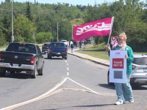 Samantha Brown, a registered practical nurse at the Lake of the Woods District Hospital, outside the hospital on Friday afternoon July 17 . Brown was one of a dozen healthcare workers hospital and CUPE who demonstrated on Friday against the provincial governments new rules for healthcare workers as the province reopens.