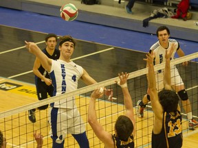 Justin Delorme, left, of the Keyano Huskies men's volleyball team rises up for a kill attempt during ACAC men's volleyball action against the Concordia Thunder at the Syncrude Sport and Wellness Centre in Fort McMurray Alta. on Friday February 10, 2017. Robert Murray/Fort McMurray Today/Postmedia Network