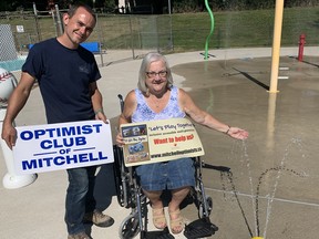 Sharon Flanagan (right), co-president of the Optimist Club of Mitchell, and West Perth Recreation & Facilities Manager Darcey Cook are beside the newly-installed "lemon drop" water feature at the West Perth splash pad July 6. The feature, plus wheelchair that Flanagan is sitting in, completes the splash pad project, and assists physically challenged children to enjoy the splash pad as well. The wheelchair and feature cost $5,300. ANDY BADER/MITCHELL ADVOCATE