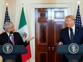 Mexico's President Andres Manuel Lopez Obrador and U.S. President Donald Trump make joint statements in the White House Cross Hall before holding a working dinner together at the White House in Washington, U.S., July 8, 2020.