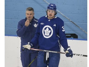 Maple Leafs coach Sheldon Keefe and Auston Matthew. POSTMEDIA NETWORK