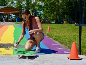 The Pride pathway in Nose Creek Park was repainted after being found covered with homphobic slurs. Photo by Kelsey Yates