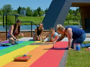 The Airdrie Pride Society is hoping to spread the message of love and inclusivity after repainting the rainbow pathway on July 3. Photo by Kelsey Yates