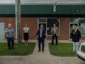 On June 26, Mayor Peter Brown, MLA Angela Pit, Minister of Mental Health and Addiction Jason Luan, MLA Peter Guthrie, and founder Kim Titus of Thumbs Up celebrate the announcement of funding for mental health initiatives in Airdrie. Photo by Tim Lowing