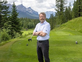 Greg Andrew, the GM/Executive Professional at the Stewart Creek Golf and Country Club in Canmore, holds his favourite putter as he stands by the first tee box. photo by Pam Doyle/www.pamdoylephoto.com