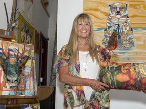 Artist Kathryn Cooke displays some of her artwork in her Blue Eyes Studio in the Elk Run Industrial Park in Canmore. photo by Pam Doyle/www.pamdoylephoto.com